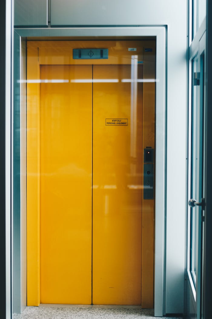 Home 2 Closed Yellow Elevator Door